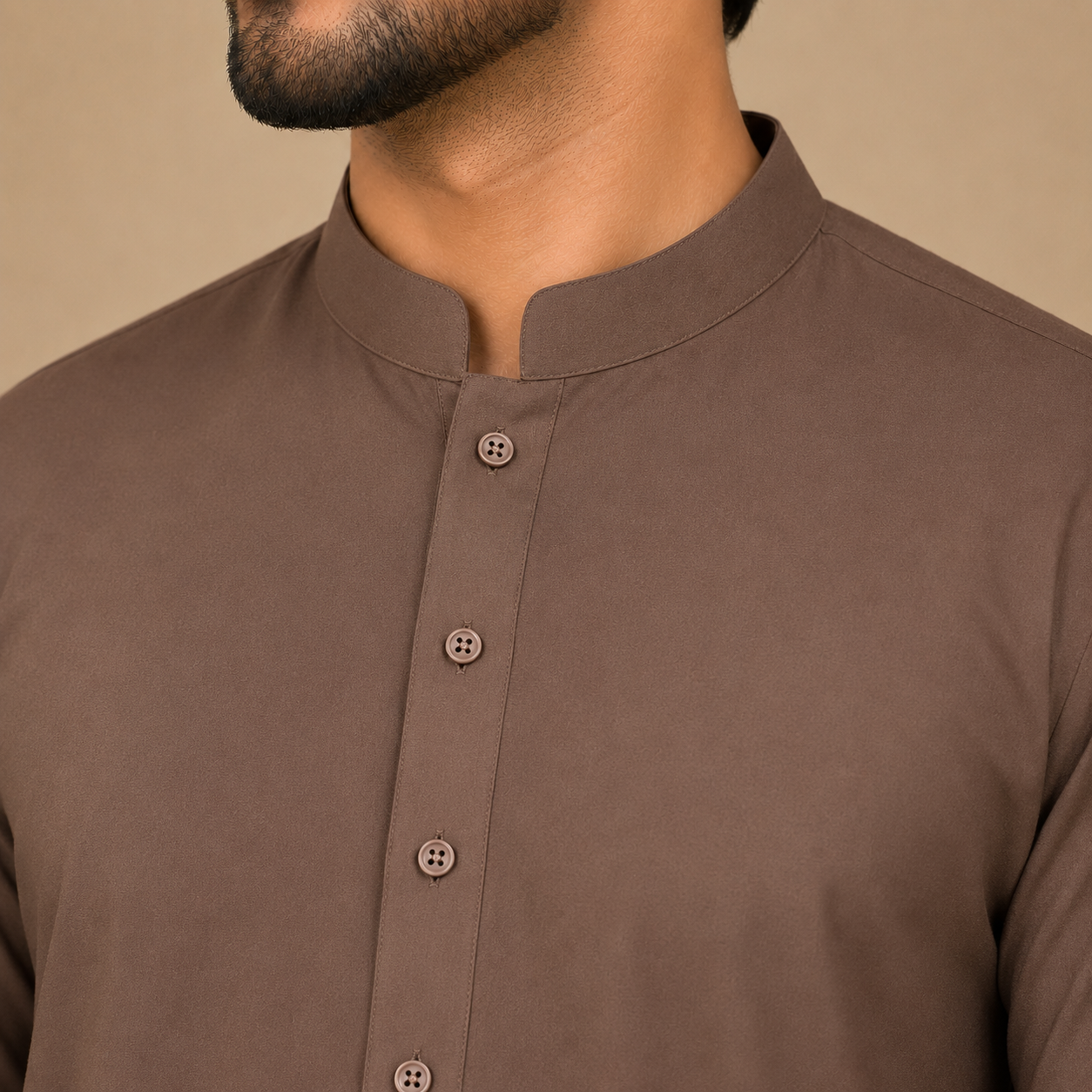 Close-up of men's mocha brown band collar shalwar kameez with premium stitching